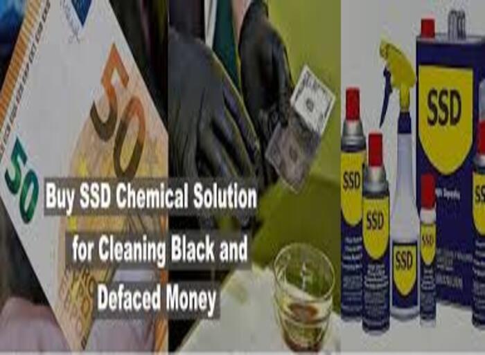 Person using SSD chemical solution to clean black money notes with gloves in a lab setup.