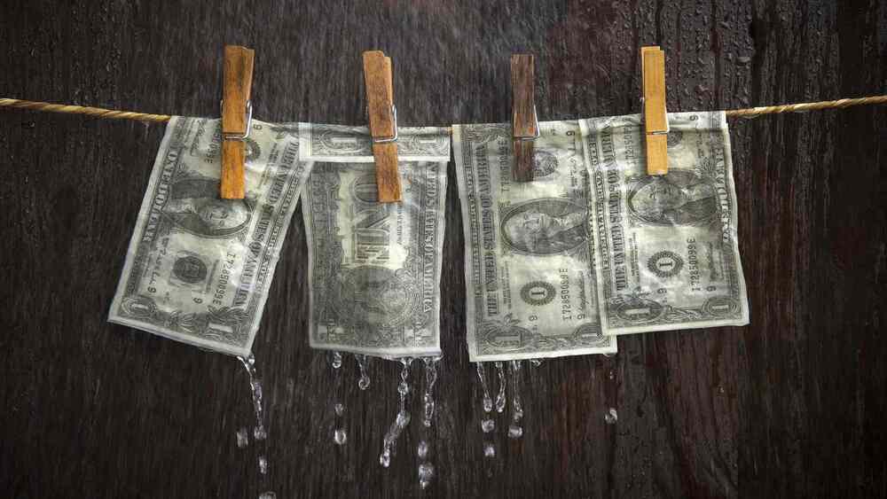 Client receiving professional support for cleaning black money using SSD solution and activation powder.